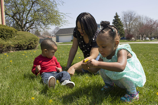 Photo of Shatrece Coleman in park with kids